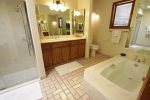 Master en suite bath has large soaking tub